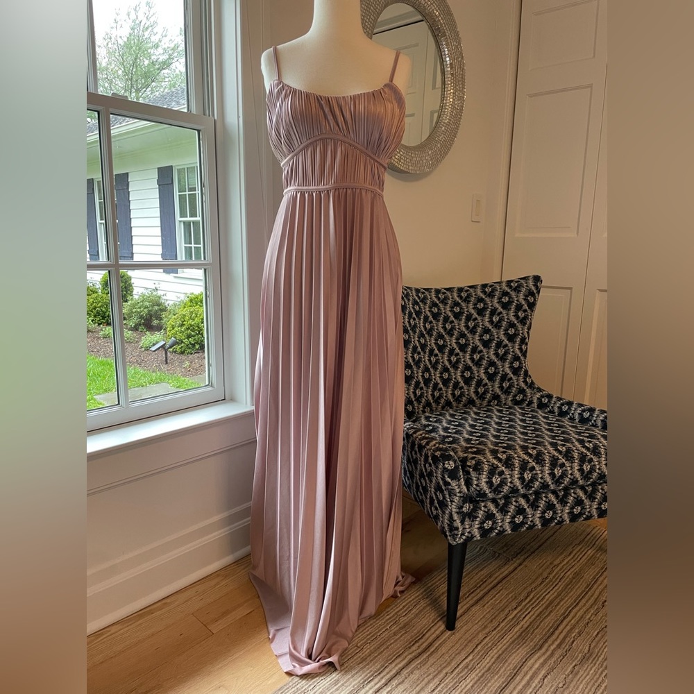 Pleated long column in pretty mauve. Fitted pleated bust line. Party ready!